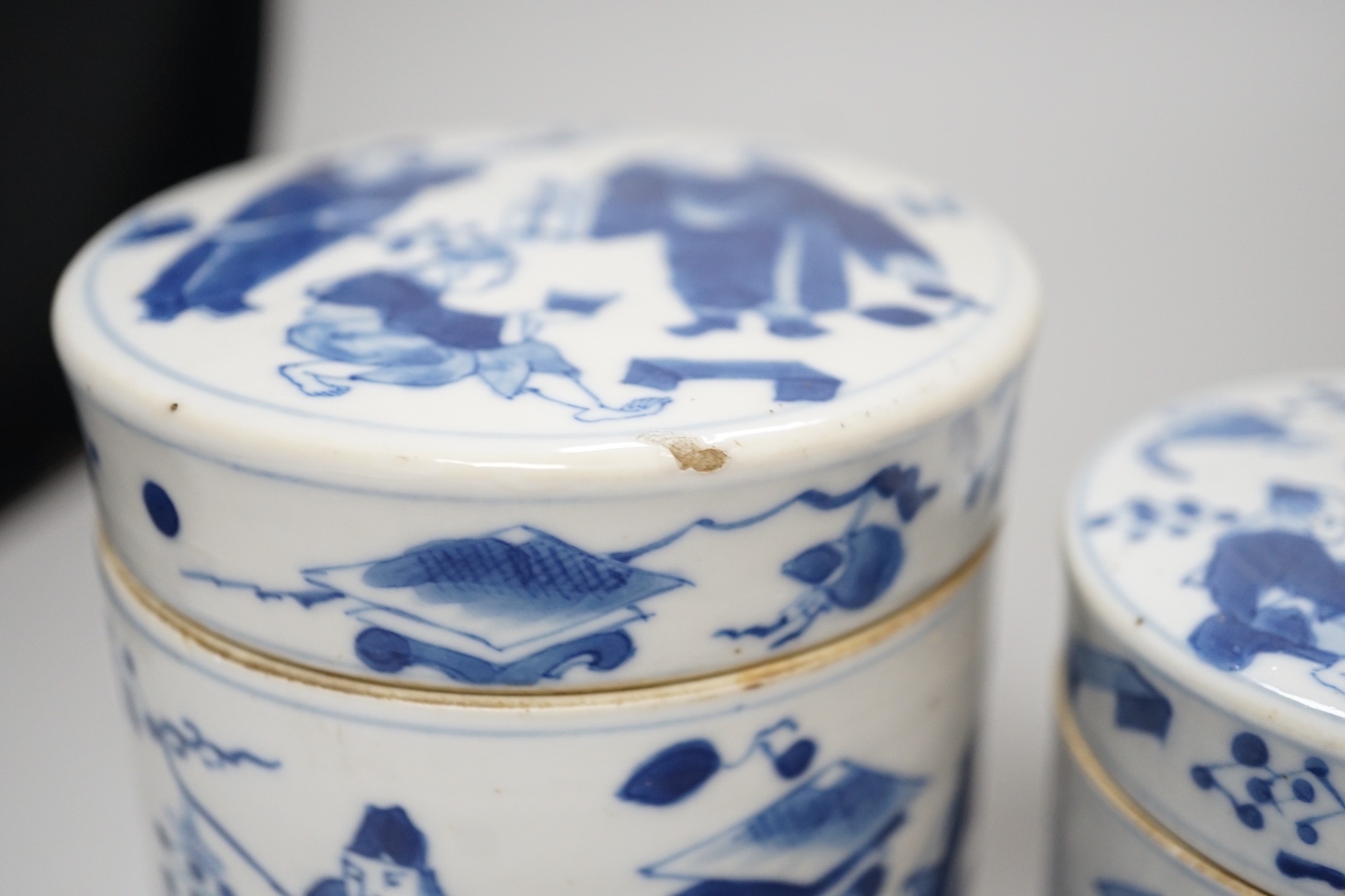 A set of four 19th century Chinese graduated blue and white jars and covers and a small jar with another design (5). Tallest 12cm